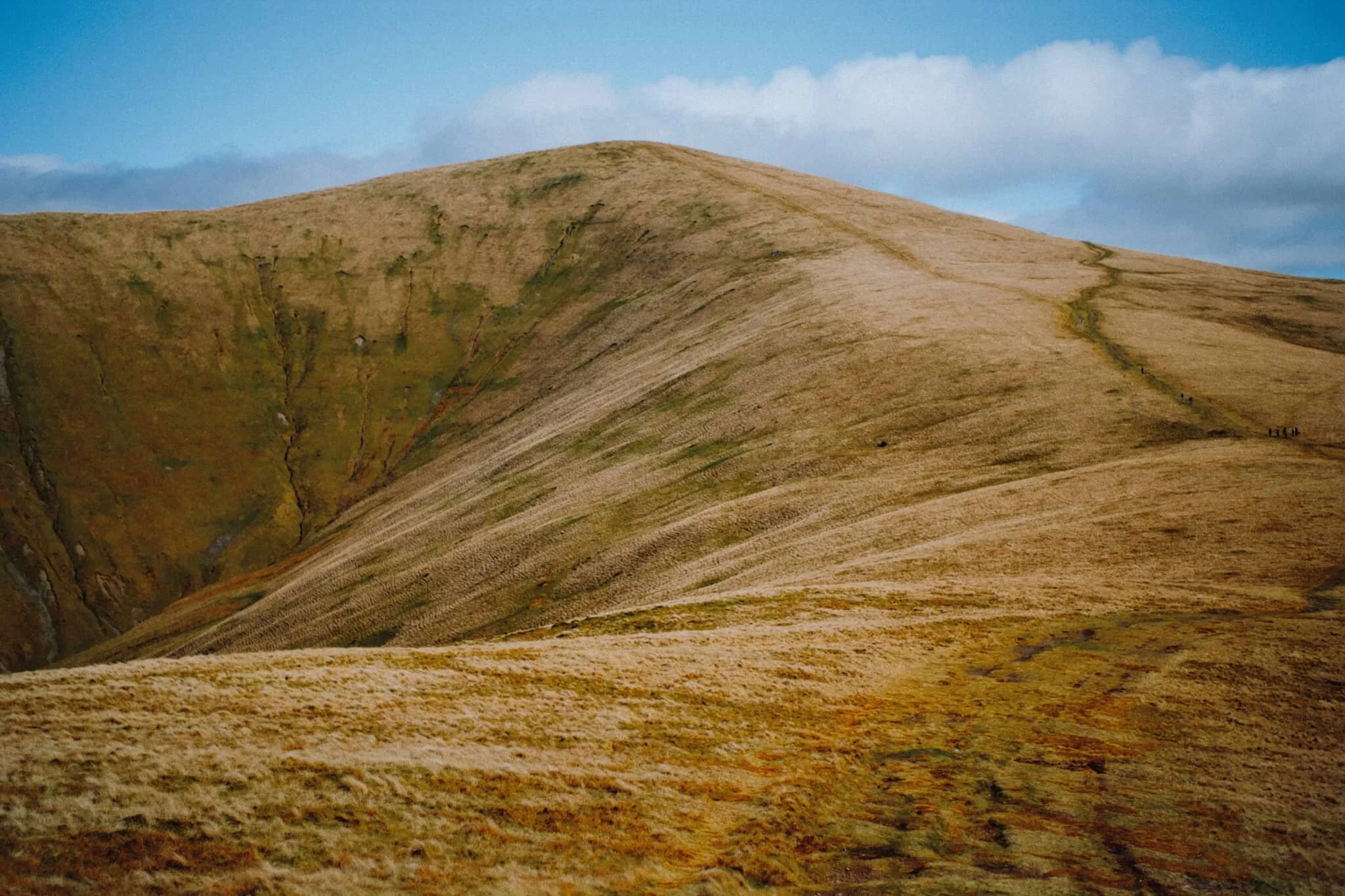   What a sight . The Dales High Way carries on around the flank of Arant Haw (605 m/1,985 ft), a beautifully sculpted fell with a precipitous southwestern face. 