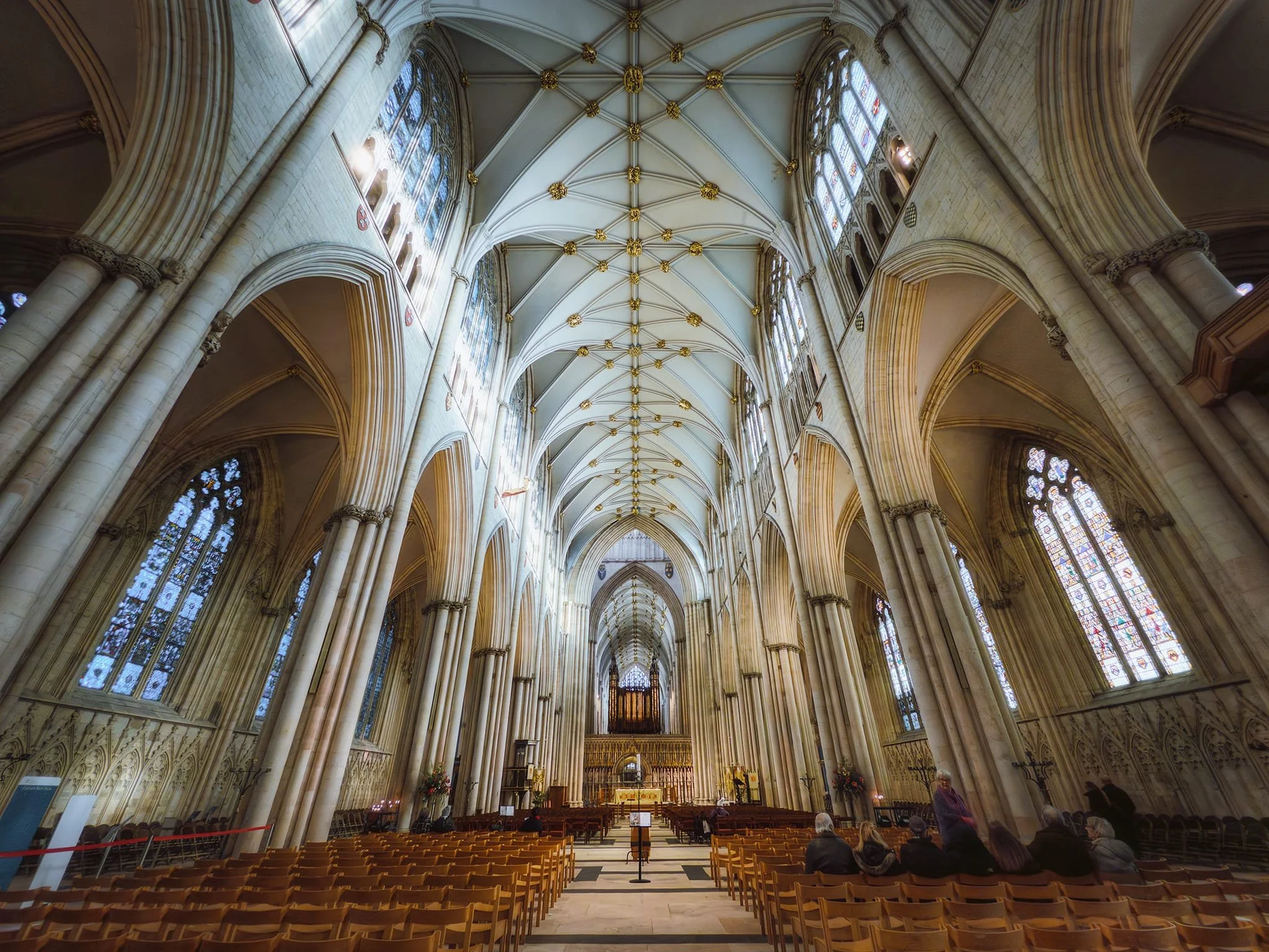  Looking all the way down York Minster&rsquo;s nave. Built between 1291 and c. 1350 in the Decorated Gothic style, the nave is England&rsquo;s widest Gothic nave, featuring a wooden roof painted to resemble stone and stone-vaulted aisles. 