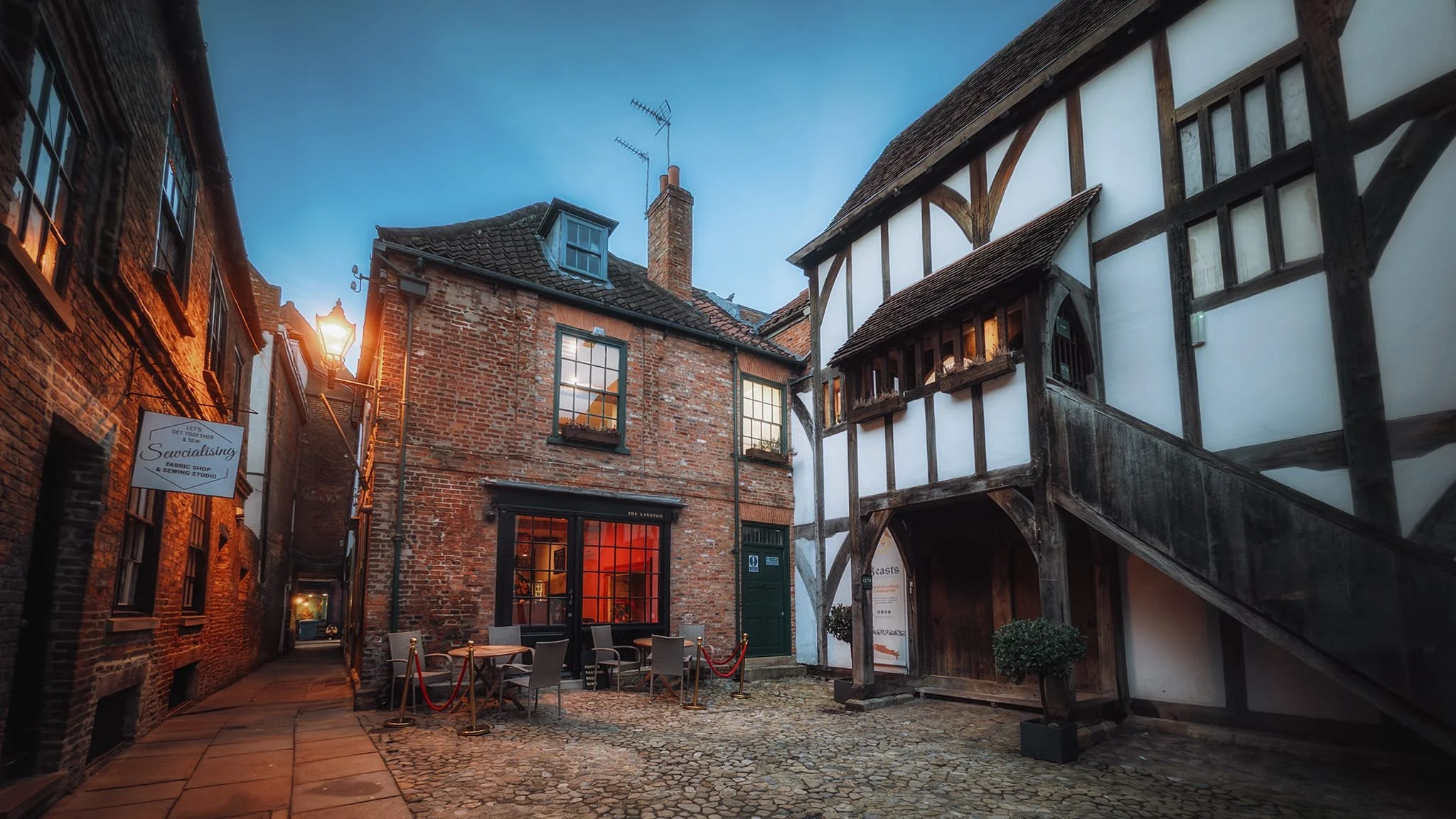  Hidden away down a narrow alley called Coffee Yard between Grape Lane and Stonegate, the timber-framed building is Barley Hall. Built around 1360 by monks of Nostell Priory and extended in the 15th century, the hall fell into decline over the centuries, becoming subdivided and dilapidated by the 20th century. The  York Archaeological Trust  purchased it in 1987, restored it extensively, and reopened it as Barley Hall museum. 